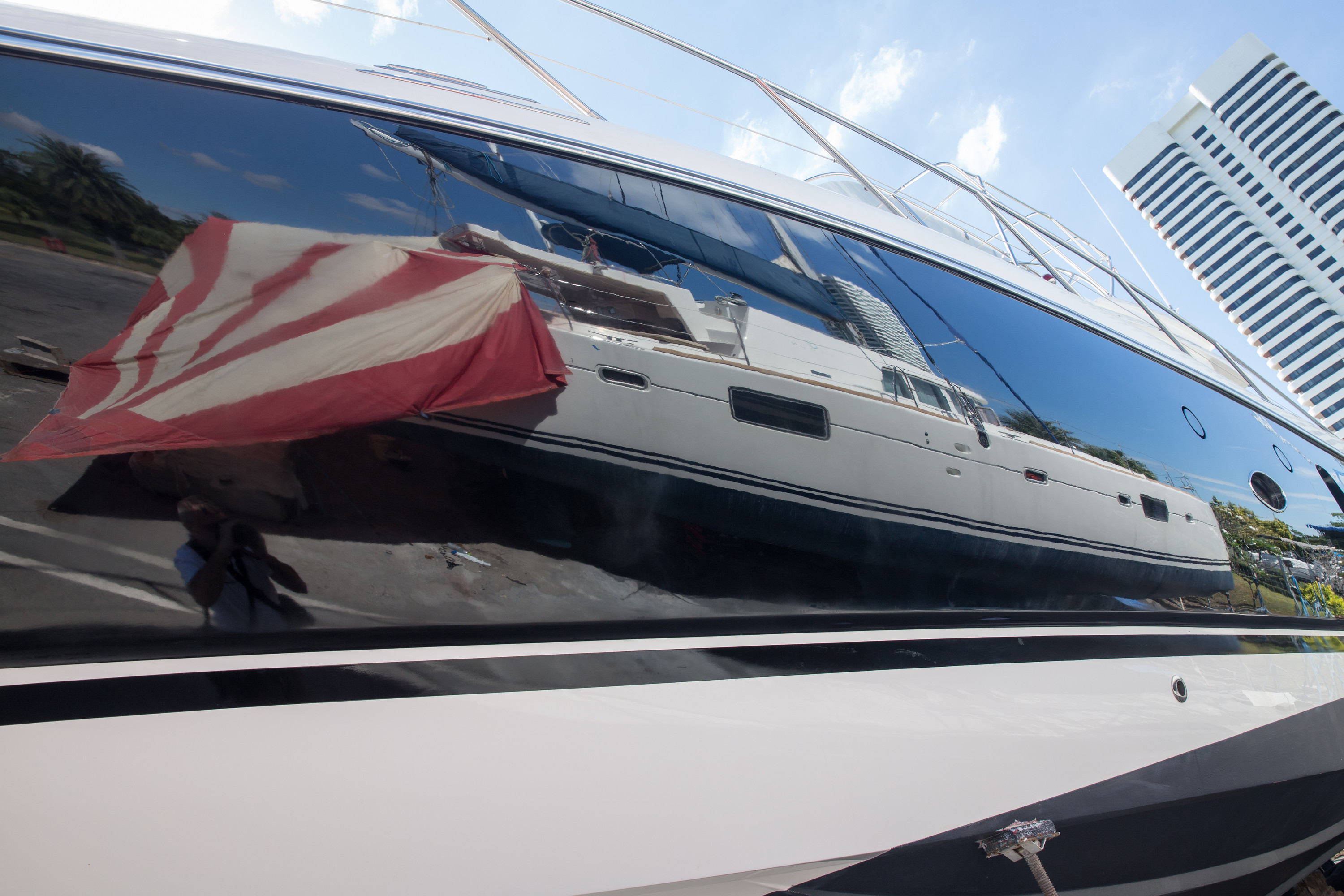 Mirror-gloss black yacht topsides after refit, Thailand